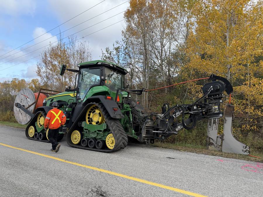 Apex Fibre track plow installing microduct along a Clarington road allowance